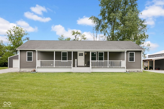 1295 Colonial Dr, Seymour, IN 47274 - view of front of house featuring covered porch, a front lawn, a garage, gravel driveway, and a shingled roof