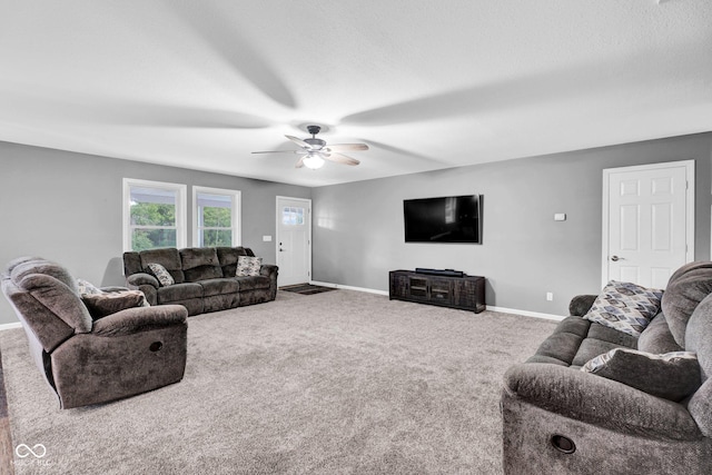 1295 Colonial Dr, Seymour, IN 47274 - carpeted living room featuring baseboards and ceiling fan