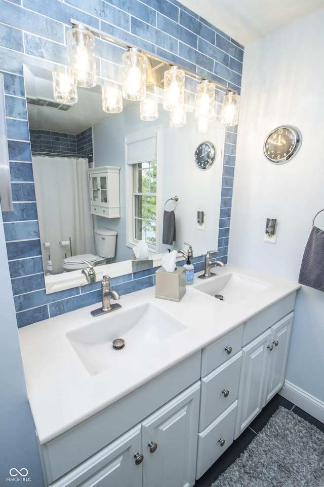 917 E Mill Creek Rd S, Greensburg, IN 47240 - full bath with double vanity, toilet, a shower with curtain, and tile patterned floors