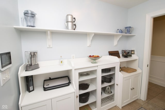 917 E Mill Creek Rd S, Greensburg, IN 47240 - kitchen featuring open shelves, light tile patterned floors, and light countertops