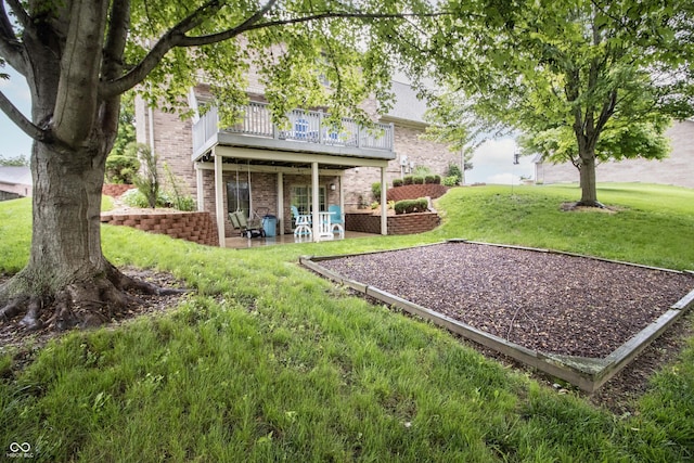 917 E Mill Creek Rd S, Greensburg, IN 47240 - back of property featuring brick siding, a yard, a patio area, and a deck