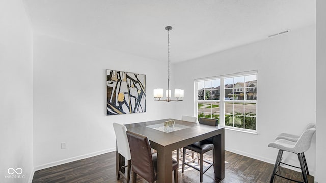 9717 Chuckwalla Pl, Fishers, IN 46040 - dining room featuring wood finished floors, a chandelier, and baseboards