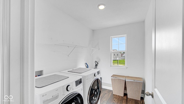 9717 Chuckwalla Pl, Fishers, IN 46040 - laundry area with washer and clothes dryer, dark wood-style floors, and baseboards