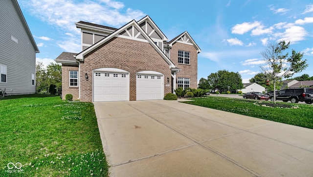 9717 Chuckwalla Pl, Fishers, IN 46040 - view of front of house featuring brick siding, an attached garage, concrete driveway, and a front yard