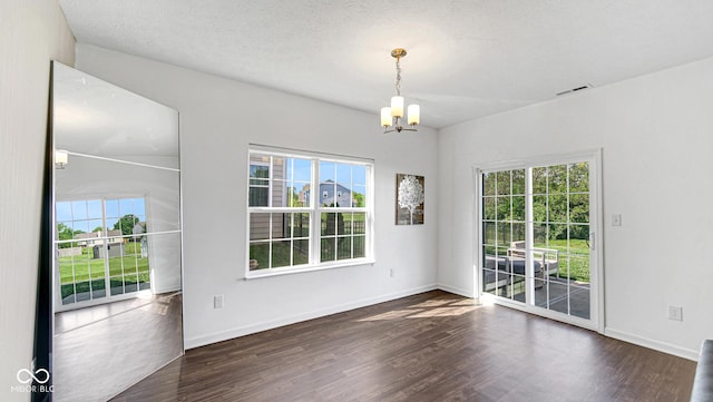 9717 Chuckwalla Pl, Fishers, IN 46040 - empty room with a chandelier, wood finished floors, and baseboards