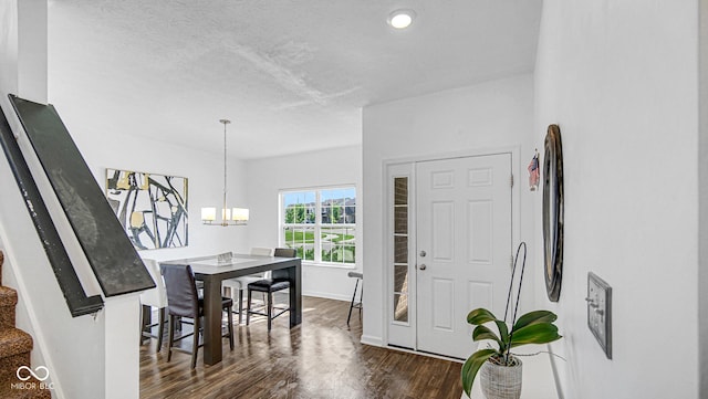 9717 Chuckwalla Pl, Fishers, IN 46040 - entrance foyer with dark wood-type flooring, baseboards, and a chandelier