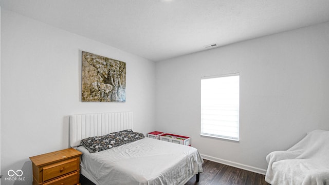 9717 Chuckwalla Pl, Fishers, IN 46040 - bedroom with dark wood-style flooring and baseboards