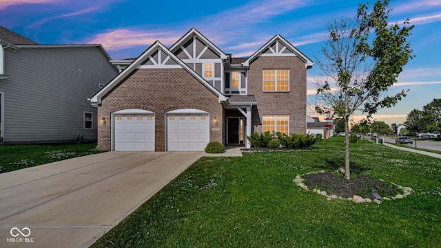 9717 Chuckwalla Pl, Fishers, IN 46040 - view of front of home with brick siding, a garage, a front lawn, and concrete driveway
