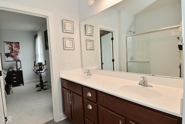 2330 Oak Dr, Clayton, IN 46118 - full bathroom featuring double vanity, a shower with door, and baseboards