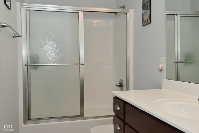 2330 Oak Dr, Clayton, IN 46118 - bathroom with vanity, toilet, and enclosed tub / shower combo