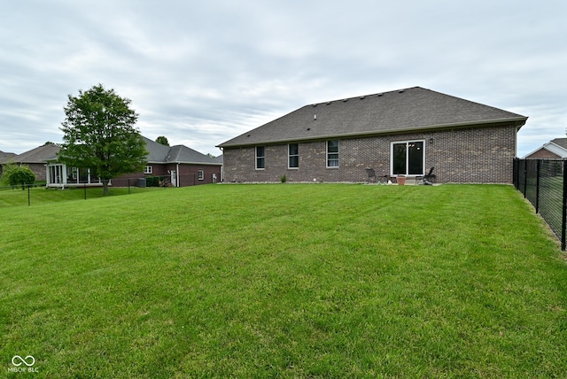 2330 Oak Dr, Clayton, IN 46118 - rear view of property with a shingled roof and brick siding
