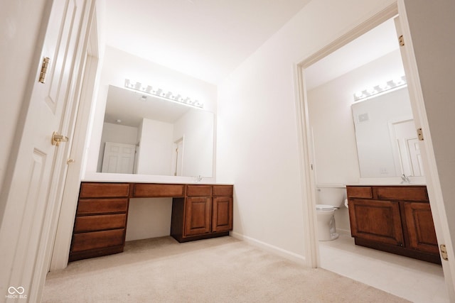 9117 Thoreau Ct, Fishers, IN 46037 - bathroom with vanity, toilet, carpet, and baseboards