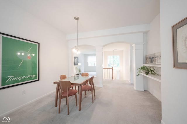 9117 Thoreau Ct, Fishers, IN 46037 - dining room with ornate columns, arched walkways, carpet, and baseboards