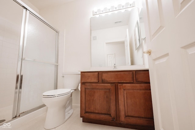 9117 Thoreau Ct, Fishers, IN 46037 - bathroom with a shower stall, toilet, vanity, and tile patterned flooring