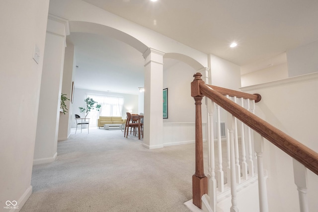 9117 Thoreau Ct, Fishers, IN 46037 - hallway with carpet, arched walkways, stairs, recessed lighting, and baseboards