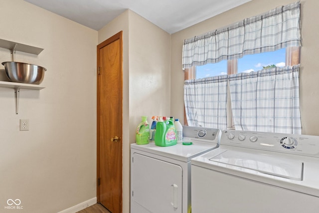 2137 W Bobwhite Dr, Scottsburg, IN 47170 - laundry room featuring washing machine and clothes dryer, baseboards, and light wood-style flooring