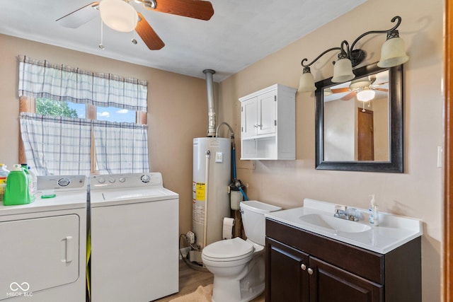 2137 W Bobwhite Dr, Scottsburg, IN 47170 - bathroom featuring gas water heater, washing machine and clothes dryer, ceiling fan, and vanity