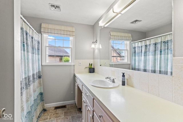 2137 W Bobwhite Dr, Scottsburg, IN 47170 - full bathroom featuring vanity, baseboards, and tasteful backsplash
