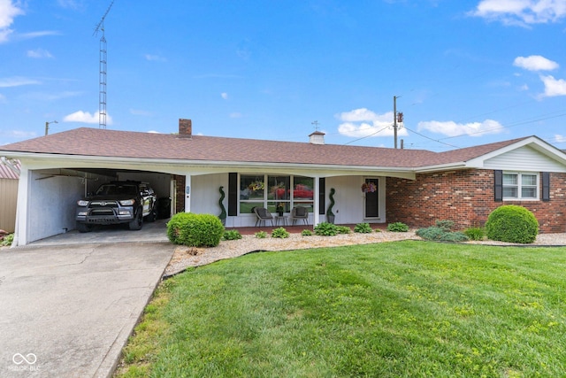 2137 W Bobwhite Dr, Scottsburg, IN 47170 - ranch-style home with covered porch, concrete driveway, a front lawn, a carport, and a chimney