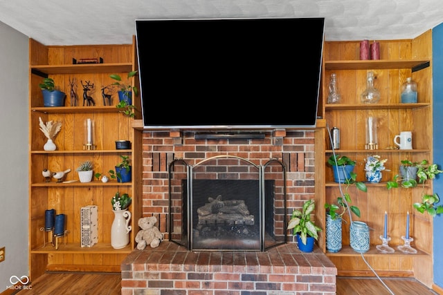 2137 W Bobwhite Dr, Scottsburg, IN 47170 - detailed view of a brick fireplace, wood finished floors, and built in shelves