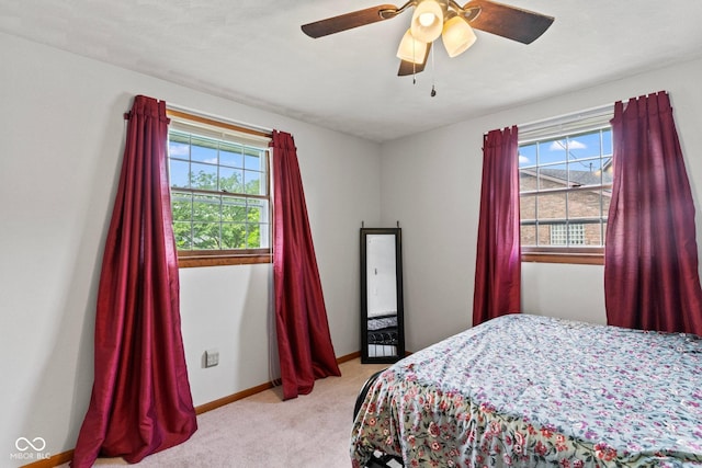 2137 W Bobwhite Dr, Scottsburg, IN 47170 - bedroom featuring light colored carpet, baseboards, and ceiling fan