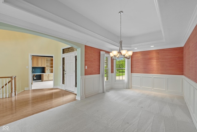 11065 Spice Ln, Fishers, IN 46037 - empty room with a chandelier, a tray ceiling, light carpet, recessed lighting, and a wainscoted wall