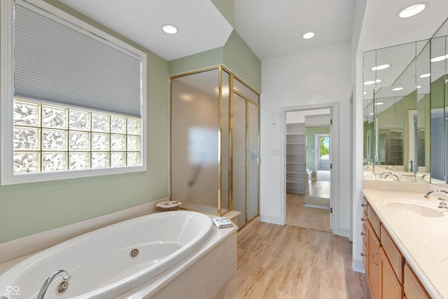 11065 Spice Ln, Fishers, IN 46037 - full bath featuring a shower stall, a whirlpool tub, vanity, wood finished floors, and recessed lighting