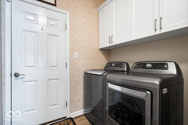 1539 Hazy Falls Blvd, Westfield, IN 46074 - washroom featuring independent washer and dryer, cabinet space, baseboards, wood finished floors, and wallpapered walls