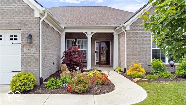 1539 Hazy Falls Blvd, Westfield, IN 46074 - property entrance featuring an attached garage, brick siding, and roof with shingles