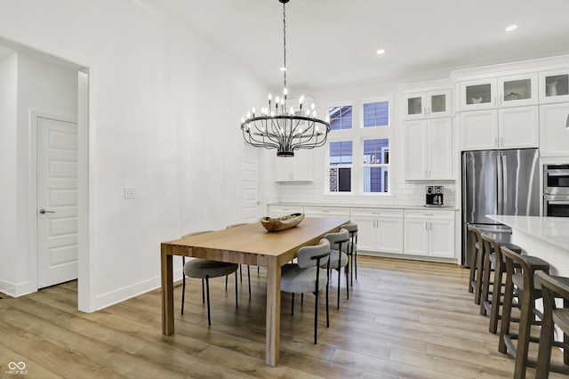 1364 Chatham Hills Blvd, Westfield, IN 46074 - dining space featuring light wood-style floors, a chandelier, recessed lighting, and baseboards