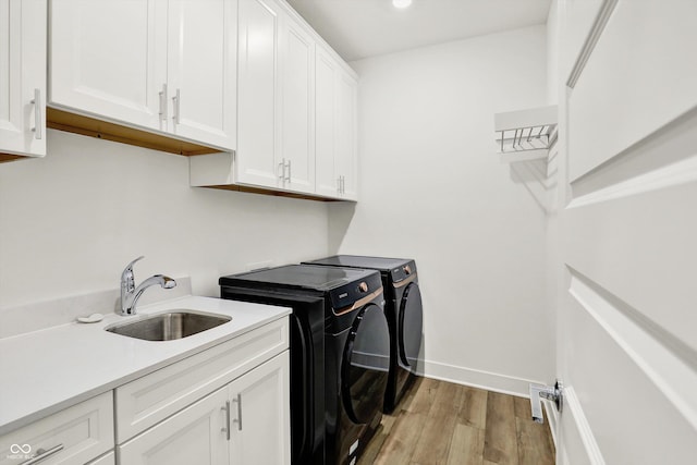 1364 Chatham Hills Blvd, Westfield, IN 46074 - laundry room featuring separate washer and dryer, cabinet space, light wood-type flooring, recessed lighting, and baseboards