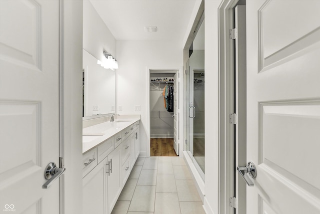 1364 Chatham Hills Blvd, Westfield, IN 46074 - bathroom with double vanity, a walk in closet, tile patterned flooring, and a shower stall