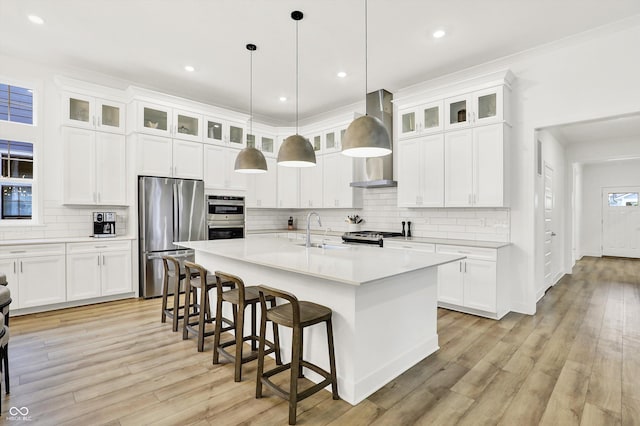 1364 Chatham Hills Blvd, Westfield, IN 46074 - kitchen featuring stainless steel appliances, a sink, wall chimney exhaust hood, light countertops, and tasteful backsplash