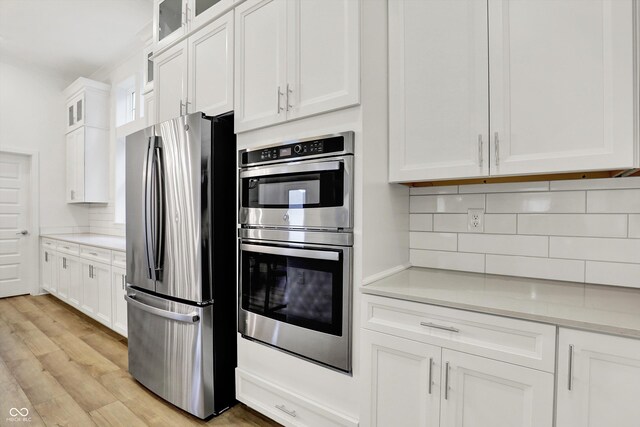 1364 Chatham Hills Blvd, Westfield, IN 46074 - kitchen featuring appliances with stainless steel finishes, tasteful backsplash, light countertops, and white cabinetry