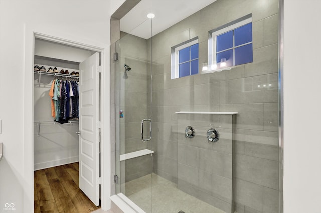 1364 Chatham Hills Blvd, Westfield, IN 46074 - bathroom with a stall shower, wood finished floors, and a walk in closet