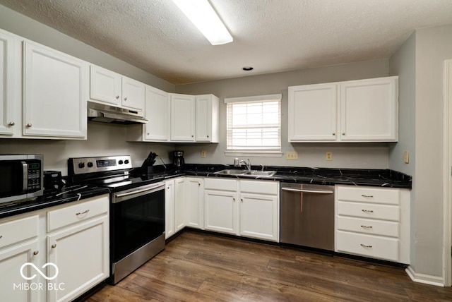 444 Austin Dr, Avon, IN 46123 - kitchen with stainless steel appliances, a sink, under cabinet range hood, white cabinetry, and a textured ceiling