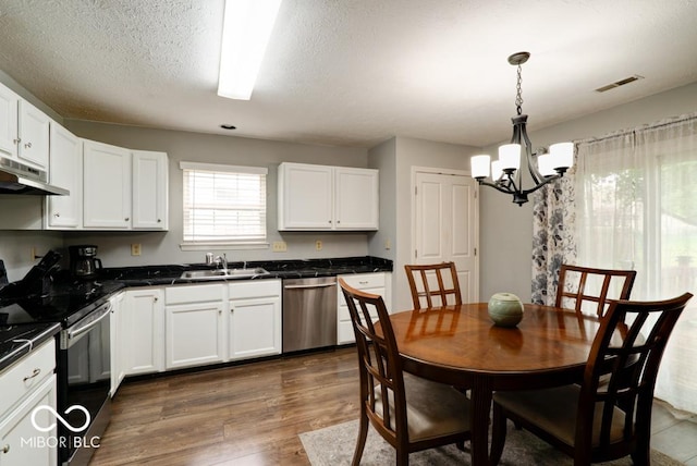444 Austin Dr, Avon, IN 46123 - kitchen featuring dishwasher, black range with electric stovetop, a sink, a chandelier, and dark countertops