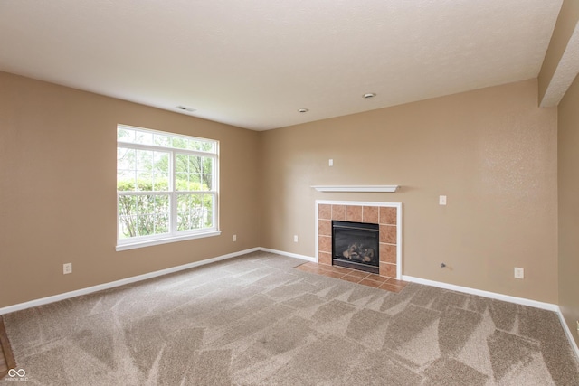 3623 Carroll Farms Dr, Indianapolis, IN 46235 - unfurnished living room featuring carpet flooring, baseboards, and a tile fireplace