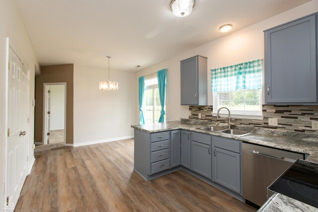 3623 Carroll Farms Dr, Indianapolis, IN 46235 - kitchen with gray cabinetry, a sink, and healthy amount of natural light
