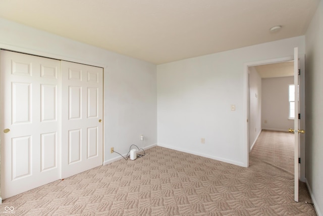 3623 Carroll Farms Dr, Indianapolis, IN 46235 - unfurnished bedroom with light colored carpet, baseboards, and a closet
