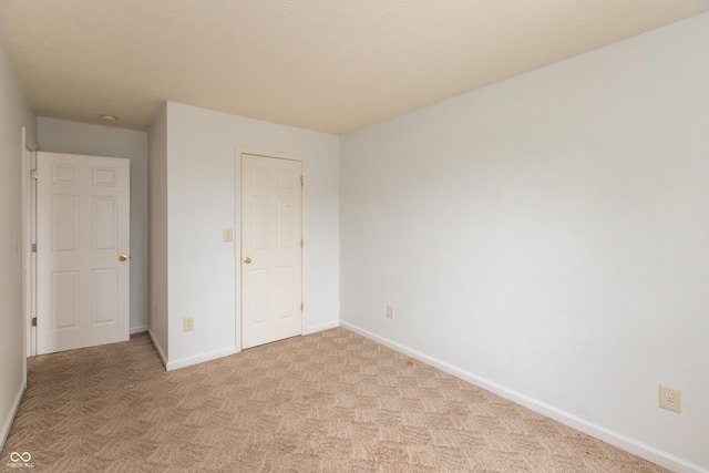 3623 Carroll Farms Dr, Indianapolis, IN 46235 - unfurnished bedroom with baseboards and light carpet
