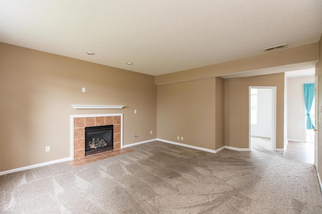 3623 Carroll Farms Dr, Indianapolis, IN 46235 - unfurnished living room with carpet, a tiled fireplace, and baseboards