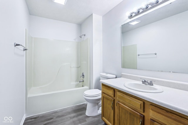12250 Longstraw Dr, Indianapolis, IN 46236 - bathroom featuring wood finished floors, vanity, shower / bath combination, and toilet