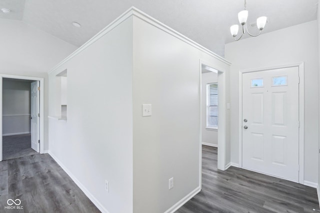 12250 Longstraw Dr, Indianapolis, IN 46236 - foyer with dark wood finished floors, a chandelier, baseboards, and vaulted ceiling