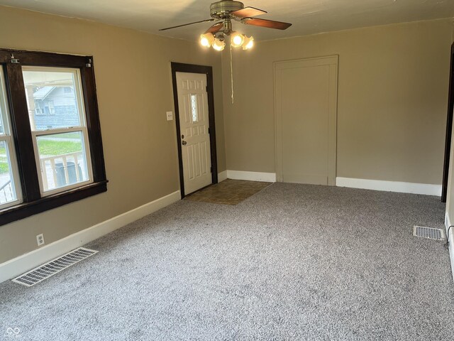 1020 E 30th St, Anderson, IN 46016 - unfurnished room with carpet flooring, ceiling fan, and baseboards