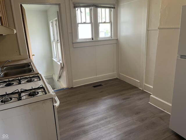 1020 E 30th St, Anderson, IN 46016 - kitchen with gas range gas stove, a sink, dark wood-style flooring, and baseboards
