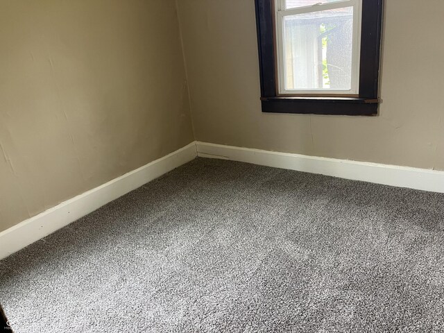 1020 E 30th St, Anderson, IN 46016 - unfurnished room with carpet floors and baseboards