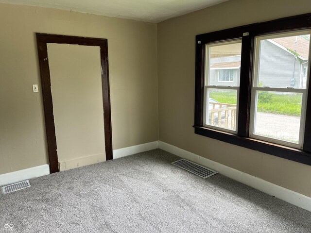 1020 E 30th St, Anderson, IN 46016 - carpeted spare room featuring baseboards