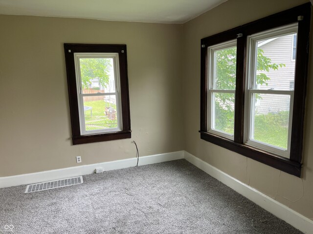 1020 E 30th St, Anderson, IN 46016 - carpeted spare room with plenty of natural light and baseboards