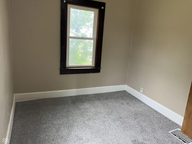 1020 E 30th St, Anderson, IN 46016 - empty room featuring carpet flooring and baseboards